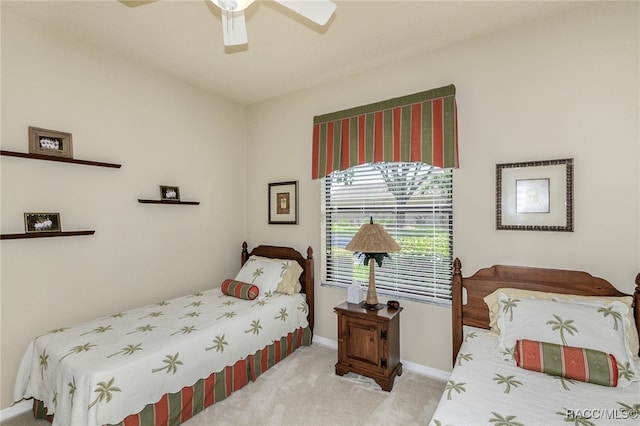 bedroom featuring ceiling fan and light carpet