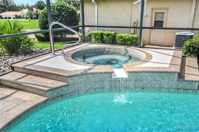 view of swimming pool with central air condition unit