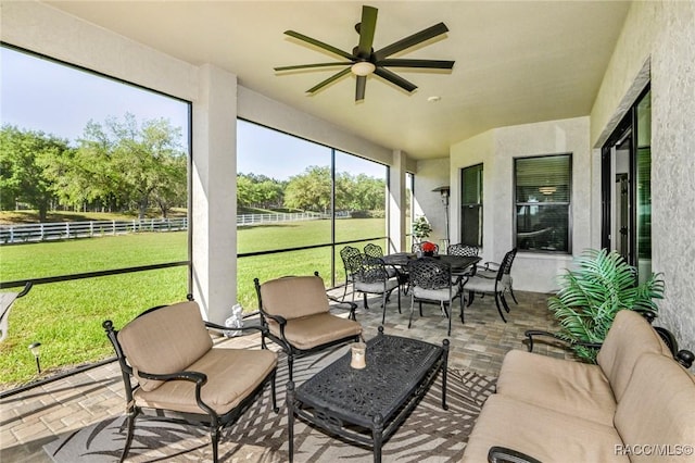 sunroom / solarium with ceiling fan