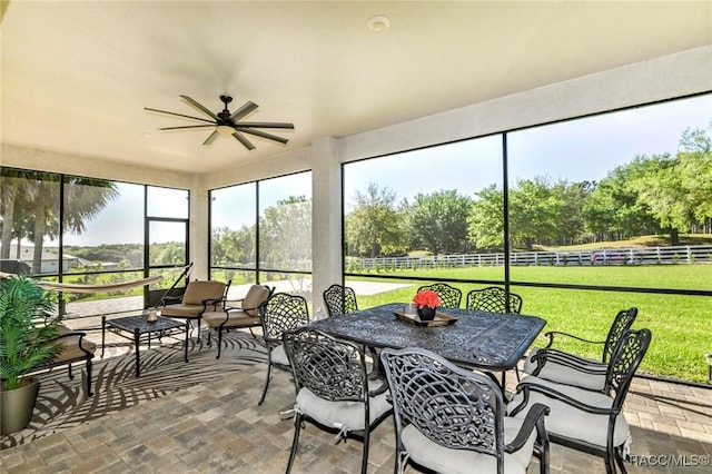 sunroom / solarium with ceiling fan