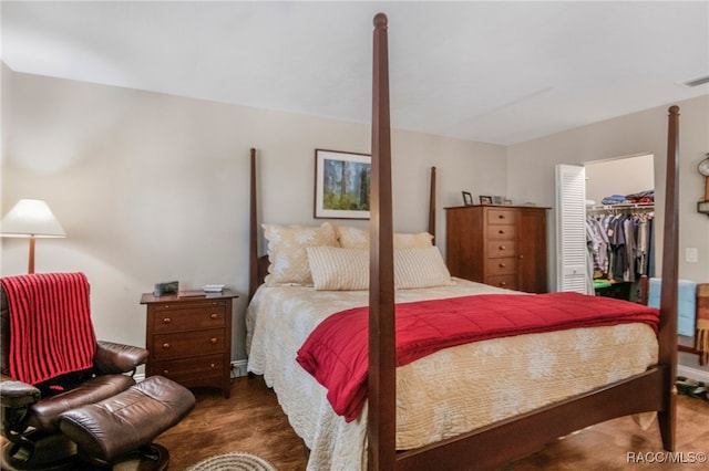 bedroom featuring a walk in closet and a closet