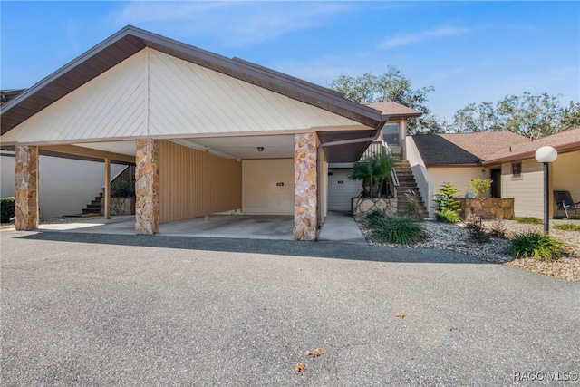 view of front of home with a carport