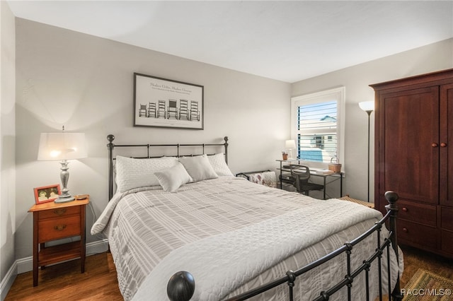 bedroom featuring dark wood-type flooring