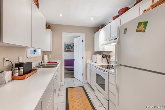 kitchen featuring light tile patterned flooring, sink, white cabinets, and white appliances