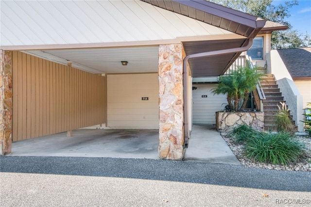 garage featuring a carport