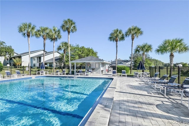 view of swimming pool featuring a gazebo and a patio area