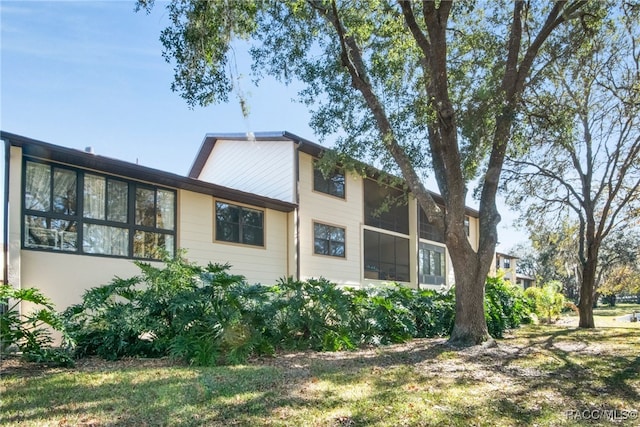 view of property exterior featuring a yard