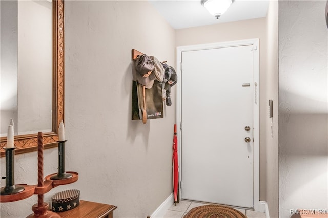 doorway with light tile patterned floors