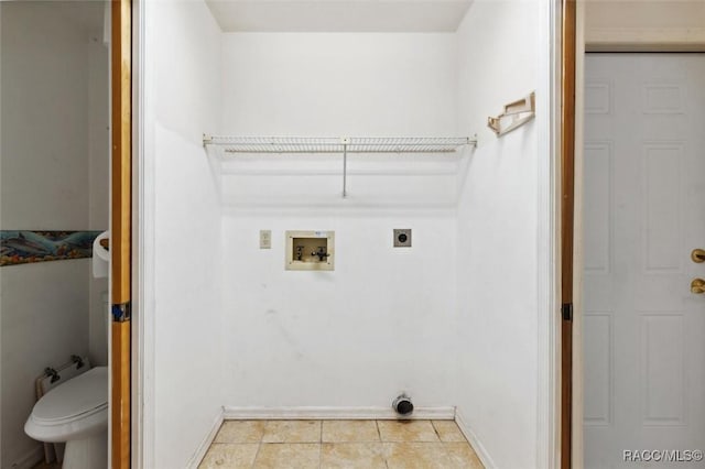 washroom featuring washer hookup, light tile patterned floors, electric dryer hookup, laundry area, and baseboards