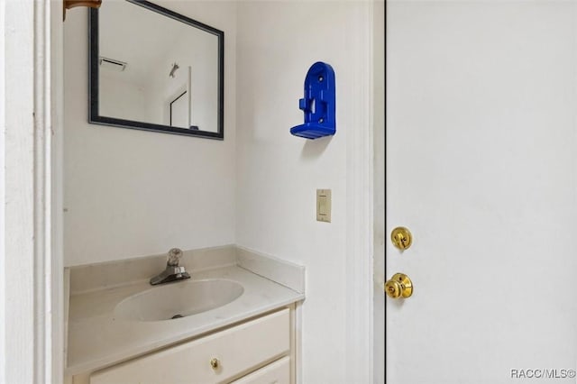 bathroom with visible vents and vanity