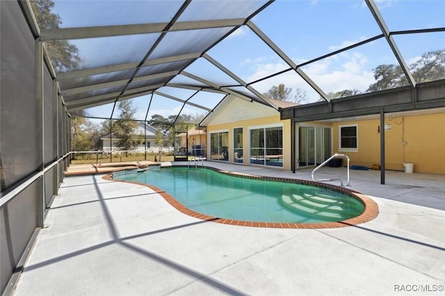 pool with a lanai and a patio