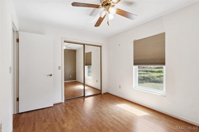 unfurnished bedroom featuring a closet, ceiling fan, and wood finished floors