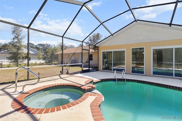 view of swimming pool with a pool with connected hot tub, a lanai, and a patio