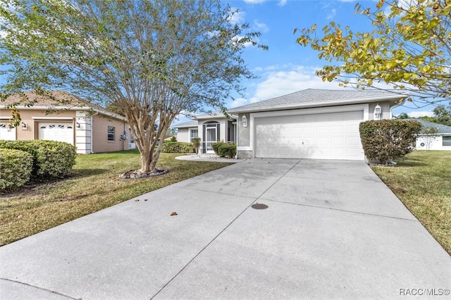 single story home featuring a garage and a front yard