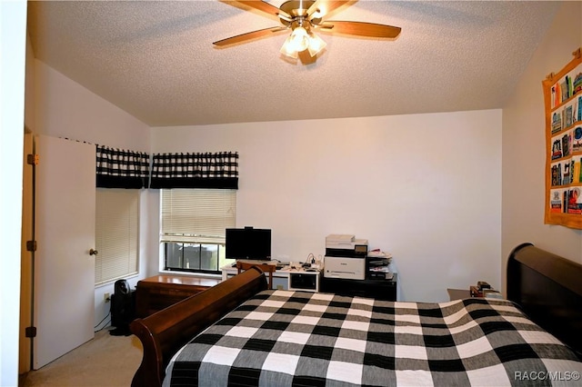 carpeted bedroom with lofted ceiling, a textured ceiling, and ceiling fan