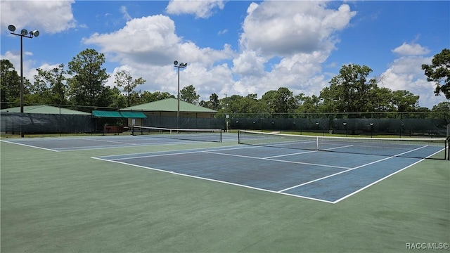 4889 N Peppermint Dr, Beverly Hills, FL 34465 - view of tennis court featuring community basketball court