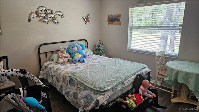 4889 N Peppermint Dr, Beverly Hills, FL 34465 - bedroom with wood finished floors and baseboards