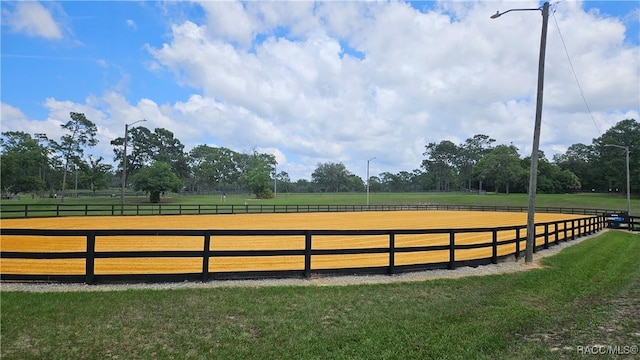 4889 N Peppermint Dr, Beverly Hills, FL 34465 - view of home's community featuring an outdoor riding arena and a yard