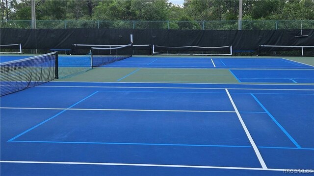 4889 N Peppermint Dr, Beverly Hills, FL 34465 - view of tennis court featuring community basketball court