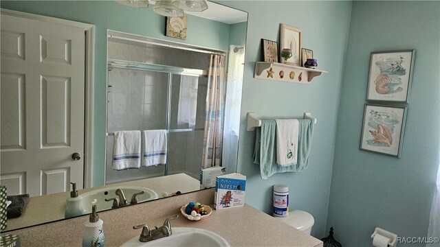 4889 N Peppermint Dr, Beverly Hills, FL 34465 - bathroom with a stall shower, toilet, and vanity