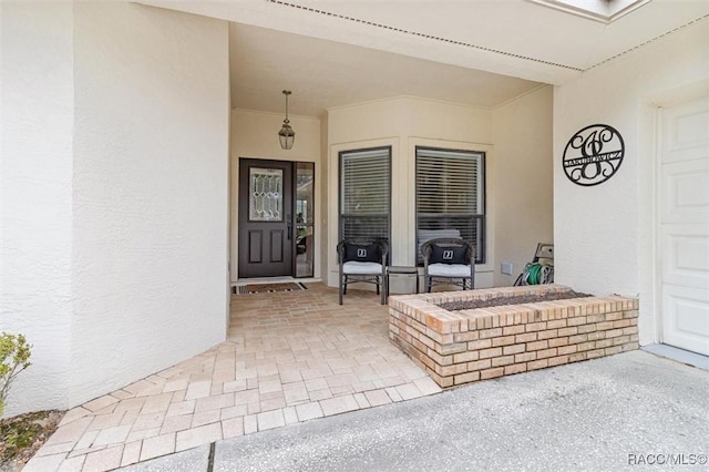 property entrance with a patio area