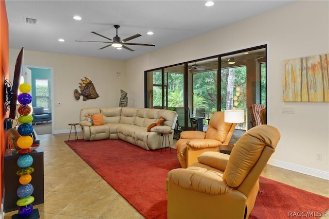 living room with ceiling fan and light tile patterned flooring