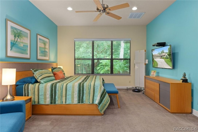 bedroom featuring light carpet and ceiling fan