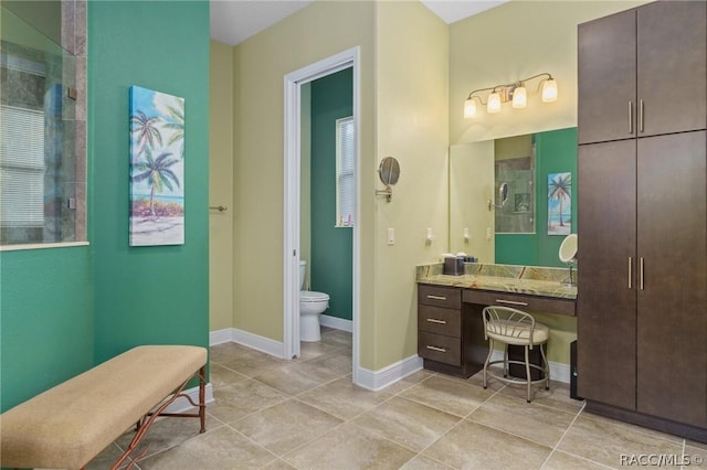 bathroom with toilet and vanity