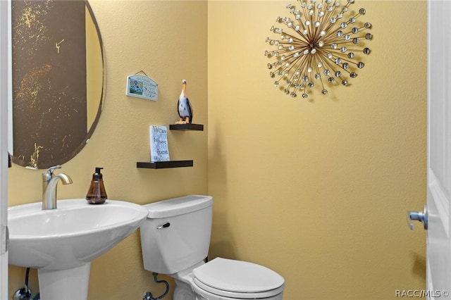 bathroom with sink and toilet