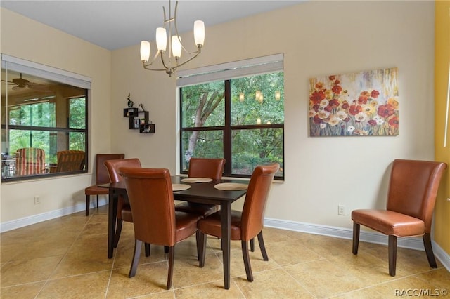 dining room with light tile patterned floors and a chandelier