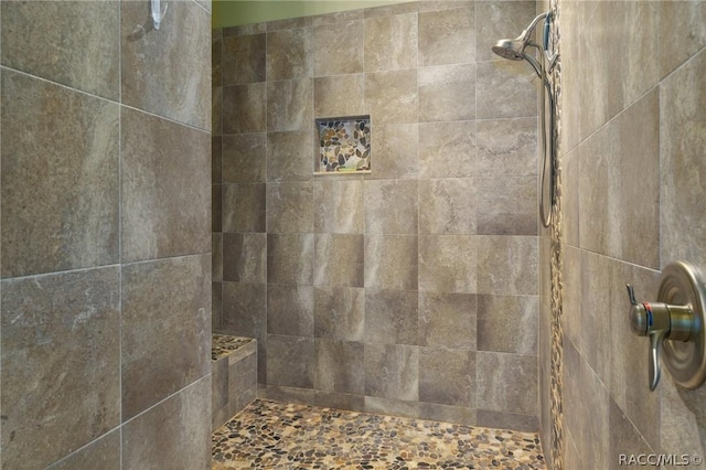 bathroom with tiled shower