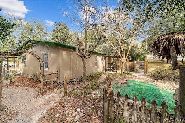 view of property exterior featuring fence