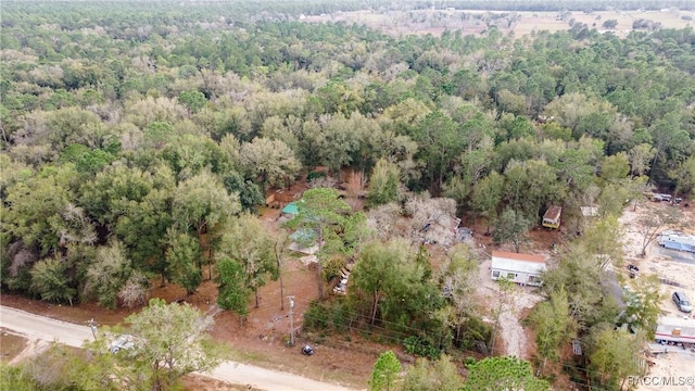 drone / aerial view with a view of trees