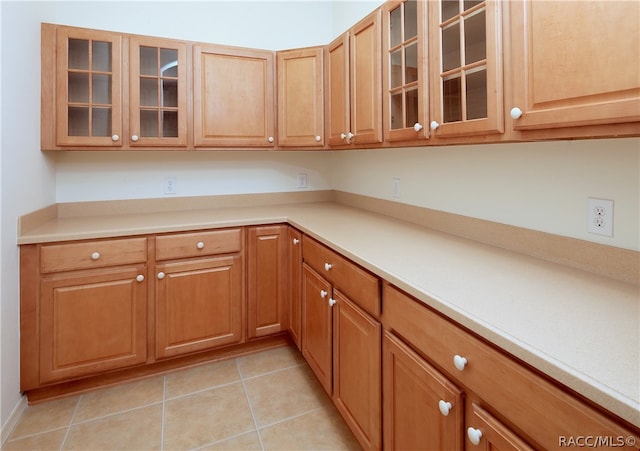 kitchen featuring light tile patterned flooring