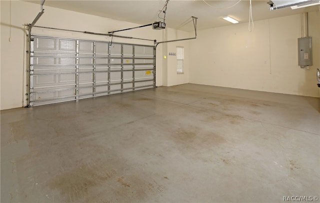 garage with a garage door opener and electric panel