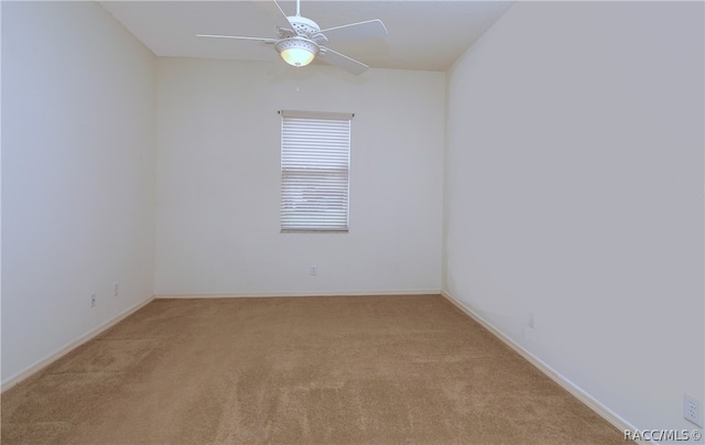 empty room with ceiling fan and light colored carpet