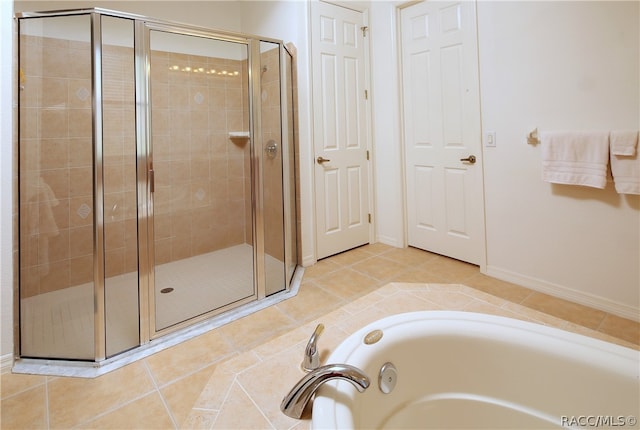 bathroom with tile patterned flooring and plus walk in shower