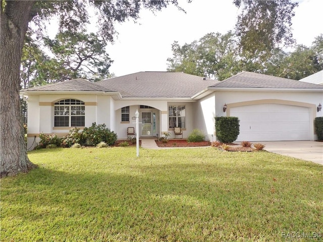 4614 N Crestline Dr, Beverly Hills, FL 34465 - ranch-style house with a garage, driveway, stucco siding, and a front lawn