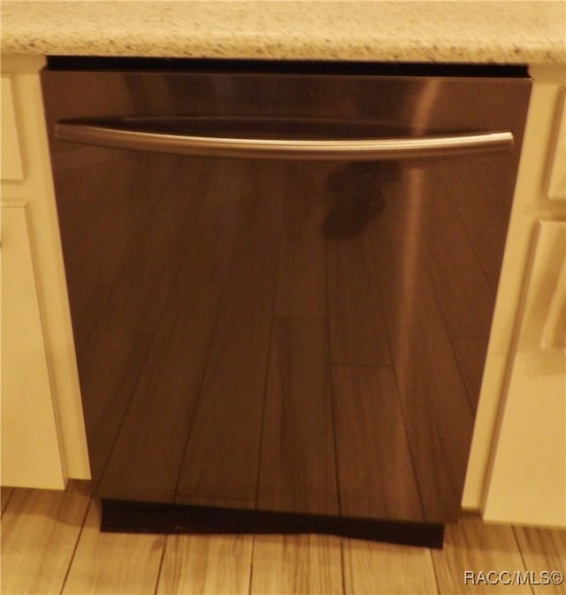 room details featuring dishwasher and light hardwood / wood-style flooring