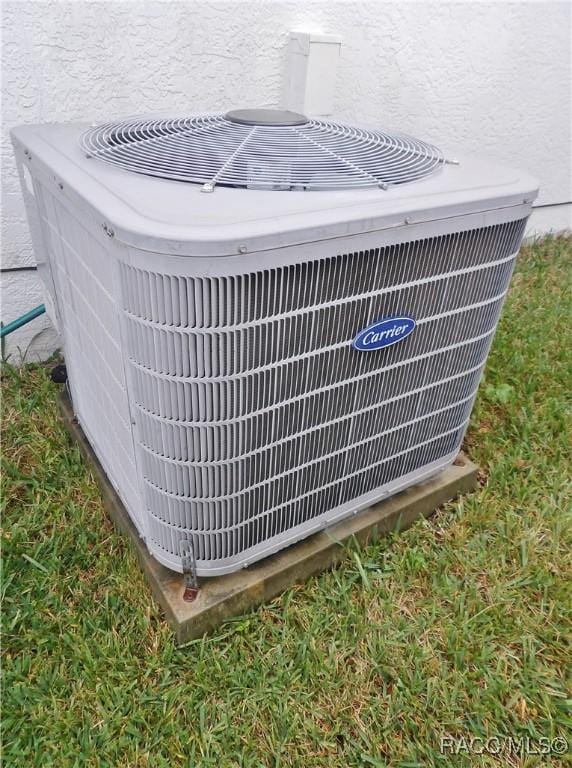 4614 N Crestline Dr, Beverly Hills, FL 34465 - exterior view of a central AC unit and stucco siding