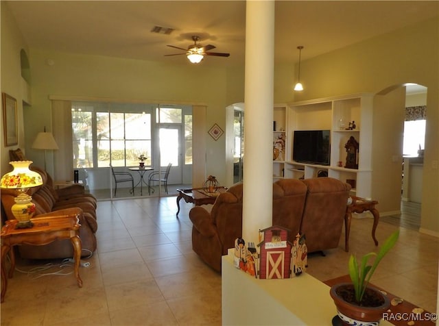 4614 N Crestline Dr, Beverly Hills, FL 34465 - living room featuring arched walkways, ornate columns, ceiling fan, and light tile patterned flooring