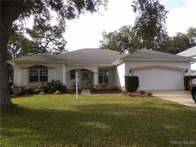 single story home featuring a front yard and a garage