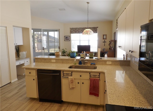 kitchen featuring sink, light wood-type flooring, black dishwasher, decorative light fixtures, and kitchen peninsula