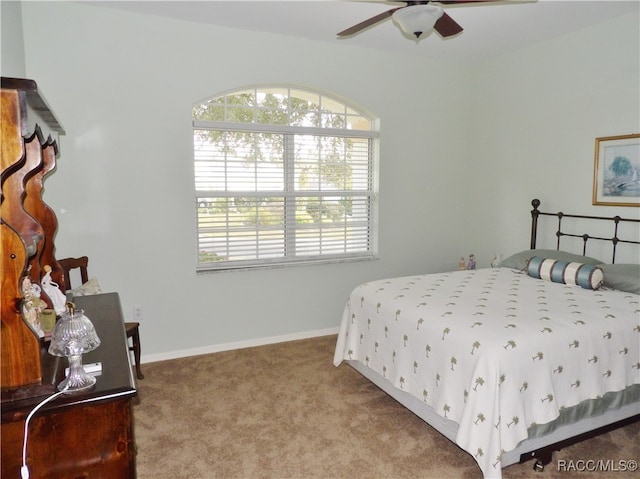 bedroom with ceiling fan and carpet floors