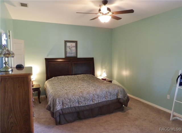 bedroom featuring ceiling fan and light colored carpet