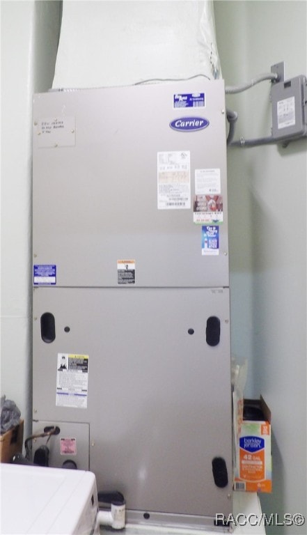 utility room with heating unit