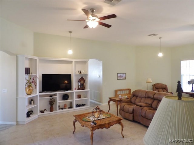 4614 N Crestline Dr, Beverly Hills, FL 34465 - tiled living room with a ceiling fan and arched walkways