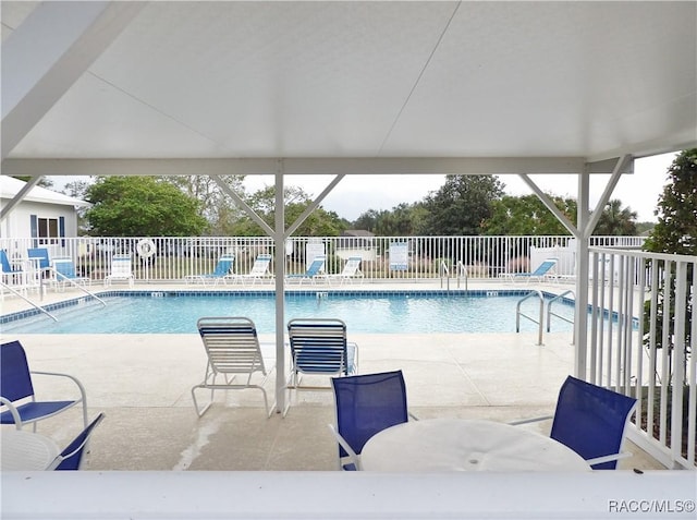 4614 N Crestline Dr, Beverly Hills, FL 34465 - community pool featuring a patio