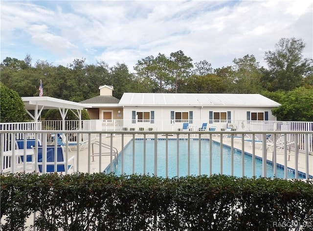 4614 N Crestline Dr, Beverly Hills, FL 34465 - community pool featuring a patio and view of wooded area