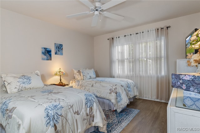 bedroom featuring hardwood / wood-style floors and ceiling fan